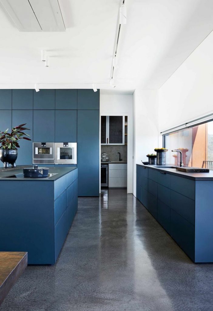 Ultra Modern Kitchen With Blue Cabinetry And Polished Concrete Floors 702x1024 